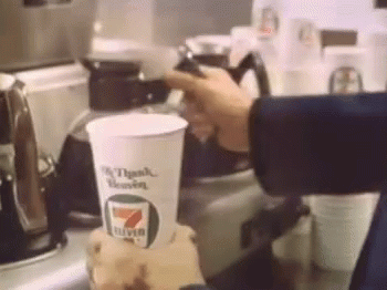 A Person Is Pouring Coffee Into A Cup That Says 7 Eleven On It GIF