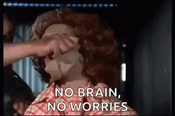 A Person Is Putting A Mask On Another Person 'S Face . GIF