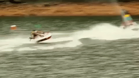 A Person Is Riding A Jet Ski On A Body Of Water . GIF