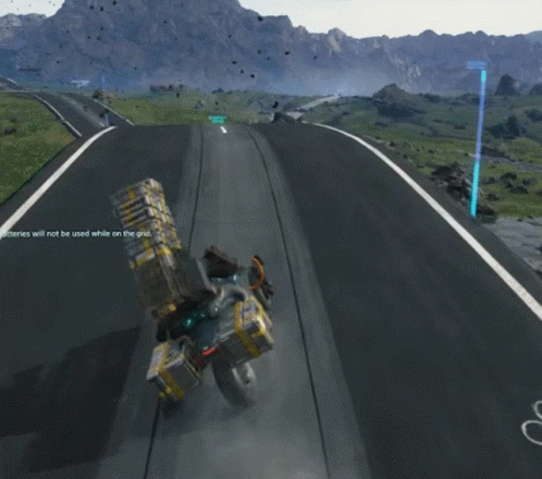 A Person Is Riding A Motorcycle Down A Road With Mountains In The Background And The Number 1 On The Right GIF