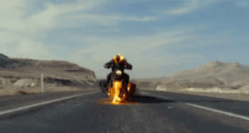 A Person Is Riding A Motorcycle On A Highway GIF