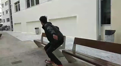 A Person Is Riding A Skateboard On A Bench GIF
