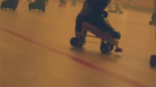 A Person Is Rollerblading On A Rink In A Blurry Photo GIF