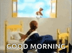 A Person Is Sitting In A Bed Looking Out A Window With The Words Good Morning Written On The Bottom GIF