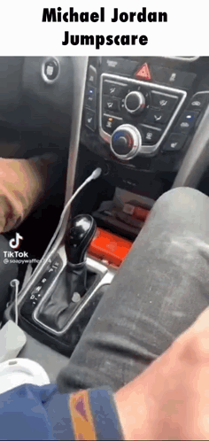 A Person Is Sitting In The Driver 'S Seat Of A Car With A Caption That Says Michael Jordan Jumpscare GIF