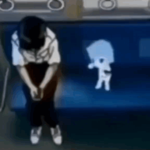 A Person Is Sitting On A Blue Couch With A Shadow Of A Person On The Couch . GIF