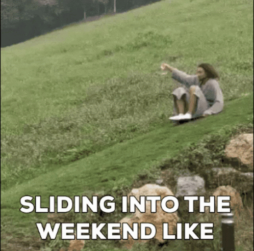 A Person Is Sitting On A Grassy Hill With The Words Sliding Into The Weekend Like GIF