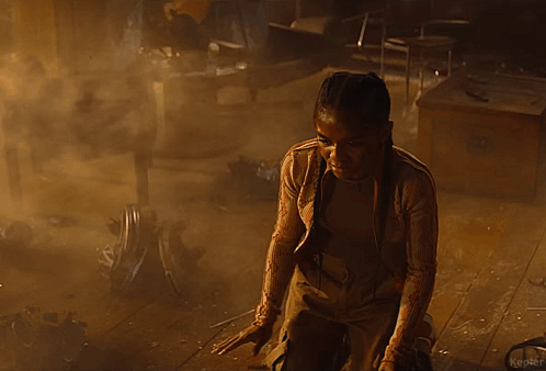 A Person Is Standing In A Dark Room In A Foggy Room . GIF