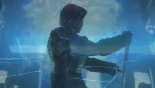 A Person Is Standing In A Dark Room With A Blue Light Behind Them . GIF