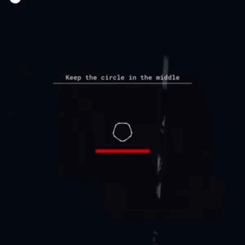 a person is standing in a dark room with a circle in the middle of the screen .