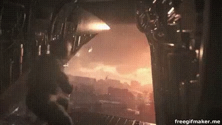 A Person Is Standing In A Dark Room With A Fire Coming Out Of It . GIF