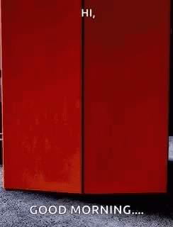 A Person Is Standing In Front Of A Door That Says Good Morning GIF
