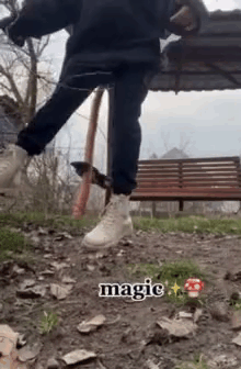 A Person Is Standing On A Dirt Path In Front Of A Park Bench . GIF