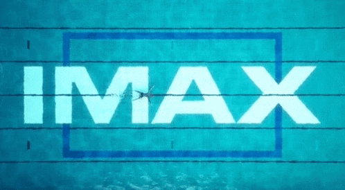 A Person Is Swimming In A Pool With The Word Imax Above Them GIF