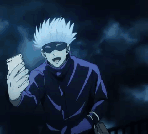 A Person Is Taking A Selfie With A Cell Phone In The Dark . GIF