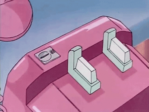A Person Is Talking On A Pink Telephone With A Green Button . GIF
