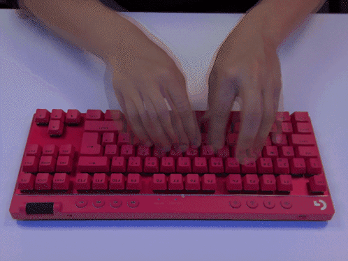 A Person Is Typing On A Red Keyboard That Has The Ctrl Key GIF