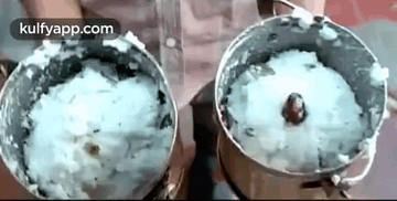 A Person Is Using A Blender To Make A Rice Dish . GIF