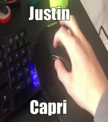 A Person Is Using A Computer Mouse With The Name Justin Capri On The Keyboard GIF