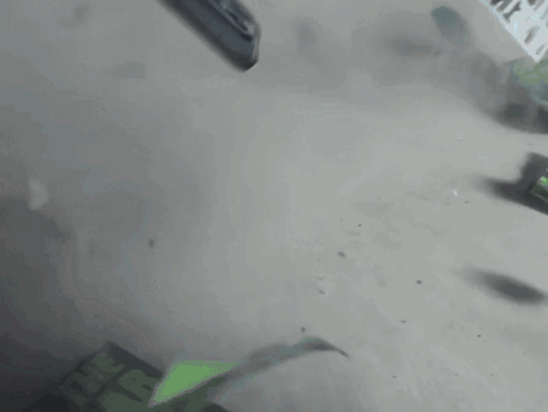 A Person Is Using A Pen To Write On A Piece Of Paper With A Green Screen GIF
