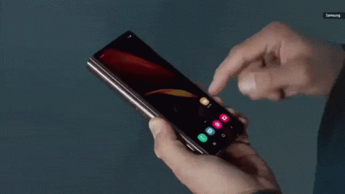 A Person Is Using A Samsung Phone In Their Hands GIF