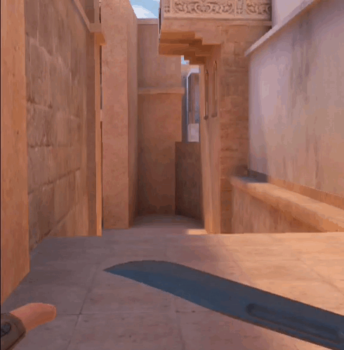 A Person Is Walking Down A Hallway With A Sword In The Foreground GIF
