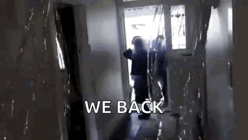A Person Is Walking Down A Hallway With The Words We Back Written On The Bottom GIF