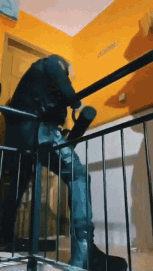 A Person Is Walking Down A Set Of Stairs With A Umbrella . GIF