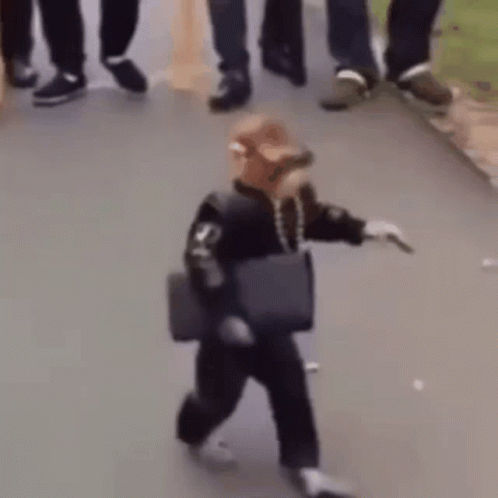 A Person Is Walking Down The Street With A Bag On Their Shoulder . GIF
