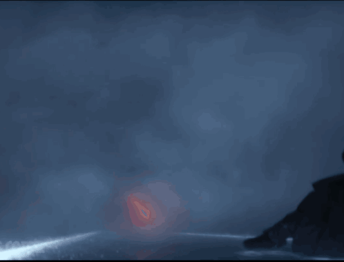A Person Is Walking Through A Tunnel Of Fire GIF
