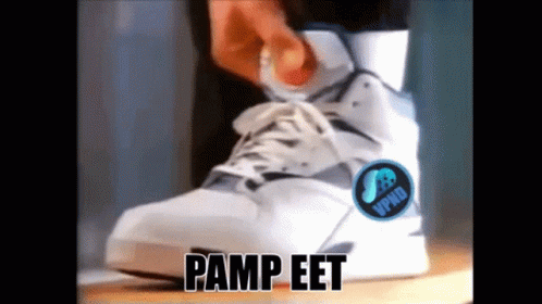 A Person Is Wearing A Pair Of Pump Eet Sneakers GIF
