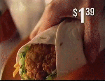 A Person Is Wrapping A Chicken Sandwich In A Tortilla With A Price Tag Of $ 1.39 GIF