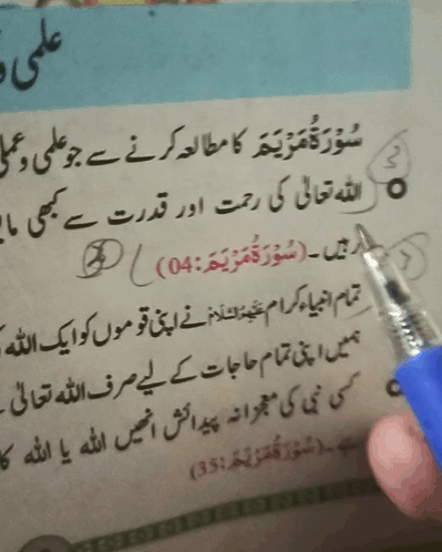 A Person Is Writing In A Book With A Pen GIF