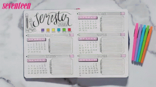 A Person Is Writing In A Notebook With Seventeen Written On The Top GIF