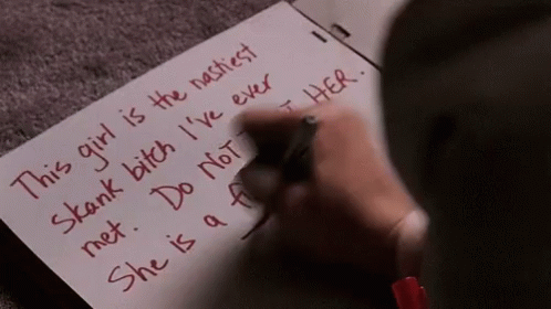 A Person Is Writing On A Piece Of Paper That Says This Girl Is The Nastiest GIF