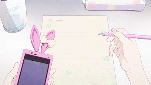 A Person Is Writing On A Piece Of Paper While Holding A Cell Phone GIF