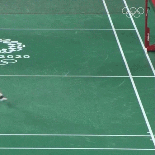 A Person Kneeling On A Tennis Court With The Year 2020 GIF