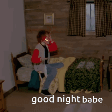 A Person Laying In A Bed With The Words Good Night Babe Written On The Floor GIF