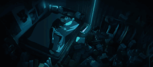 A Person Laying In A Dark Room With A Blue Light Shining On Them GIF