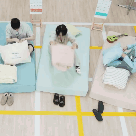 A Person Laying On A Bed With A Pillow That Says ' I Love You ' GIF