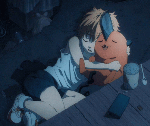 A Person Laying On A Bed With A Stuffed Animal In Their Lap GIF