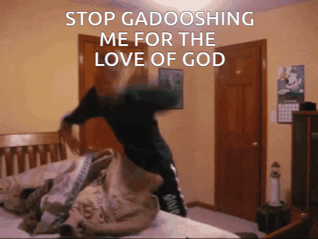 A Person Laying On A Bed With The Words " Stop Gadooshing Me For The Love Of God " GIF