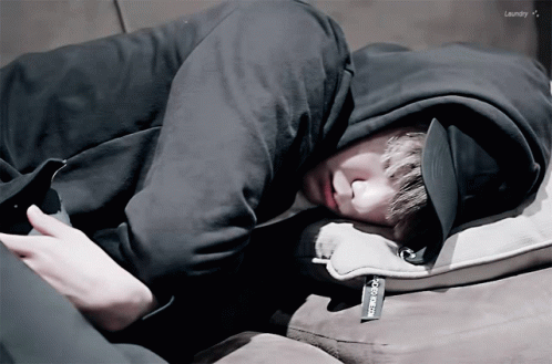 A Person Laying On A Couch With The Word Laundry On The Bottom Left GIF