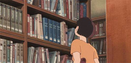 A Person Looking At Books On A Shelf With One That Says ' Chinese ' On The Front GIF