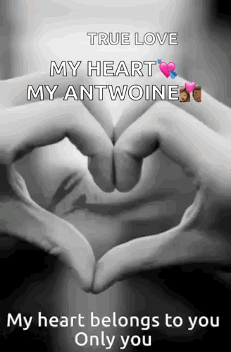 a person making a heart shape with their hands