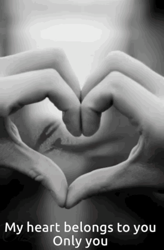 A Person Making A Heart Shape With Their Hands With The Words " My Heart Belongs To You Only You " GIF