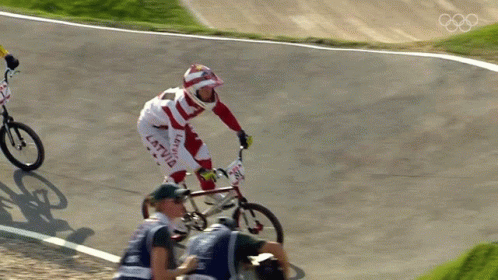 A Person On A Bike With The Word Latvia On Their Pants GIF