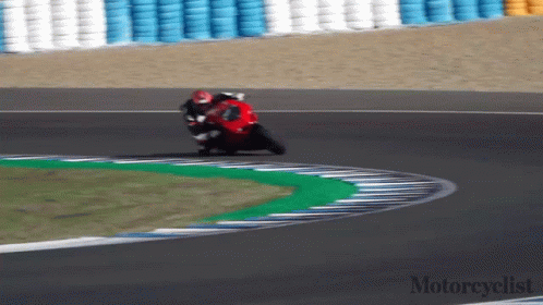 a person on a motorcycle on a track with the words motorcyclist on the bottom right