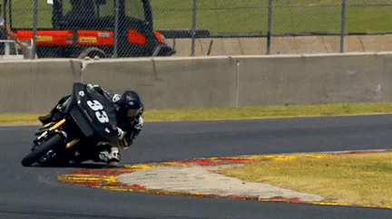 A Person On A Motorcycle With The Number 33 On Their Back GIF