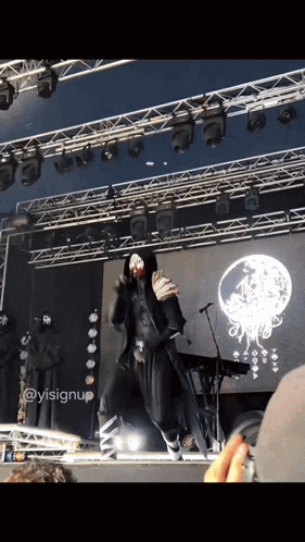 A Person On A Stage With A Sign That Says ' Ysisignup ' GIF